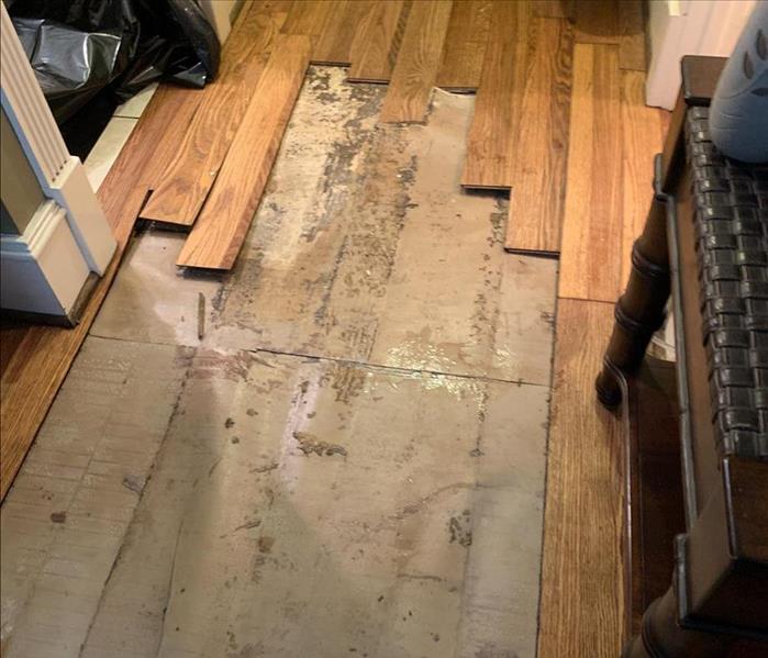 Water damaged flooring being removed.