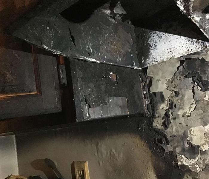 Burnt kitchen cabinets after a fire.