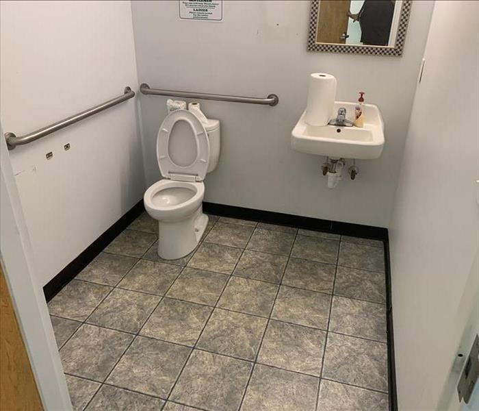 Clean bathroom in commercial facility.