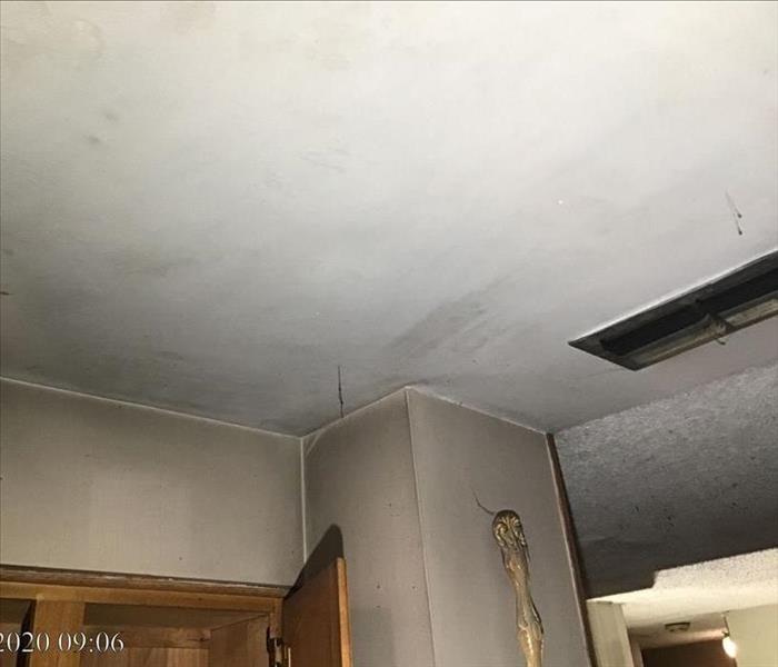 Soot damage to ceiling in a business.