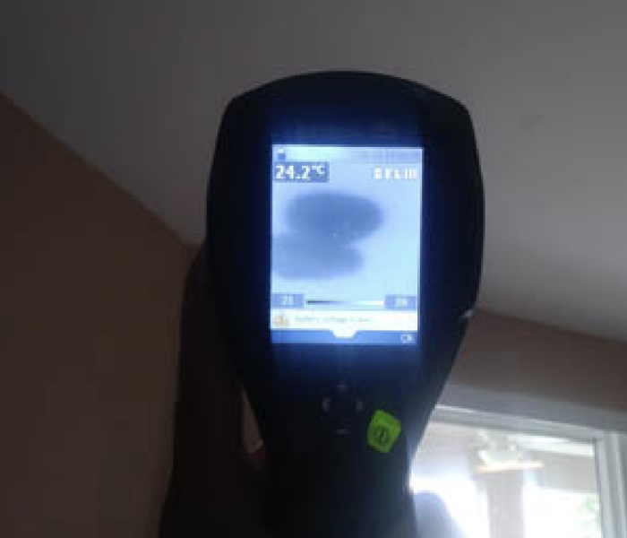 a thermal imaging camera pointing at the wall