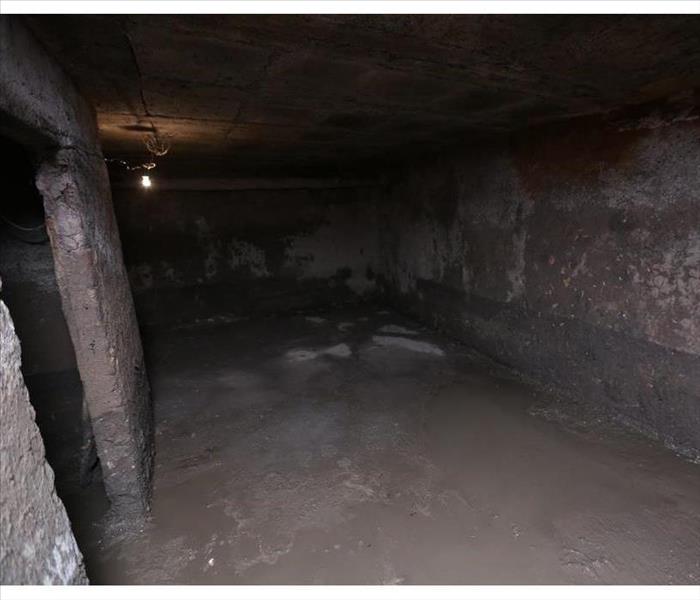 the old dirty cellar flooded from a pipe break.